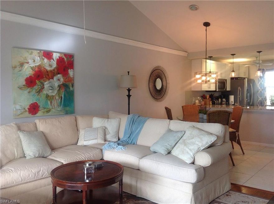 Wow!!! Outstanding Lakefront condo that was remodeled in 2016 including every valve of plumbing replaced. New open kitchen with quartz counter tops, extra counter space and instant hot & cold filtered water at sink. All new appliances and a neutral pallet of colors. Tile, and wood floors plus posh carpet in bedrooms. The new refreshed look is light and bright with soaring high cathedral ceilings. Prime end location on second floor with the gorgeous view of lake, lush landscaping, and sunset skies. 
Two bedrooms, updated bathrooms, den, dinning and living room. Screened in lanai with the most relaxing lakefront view. Amenities include community pool, walking and jogging path around lake.
Minutes to Shopping Plaza and 4 miles to Beach!