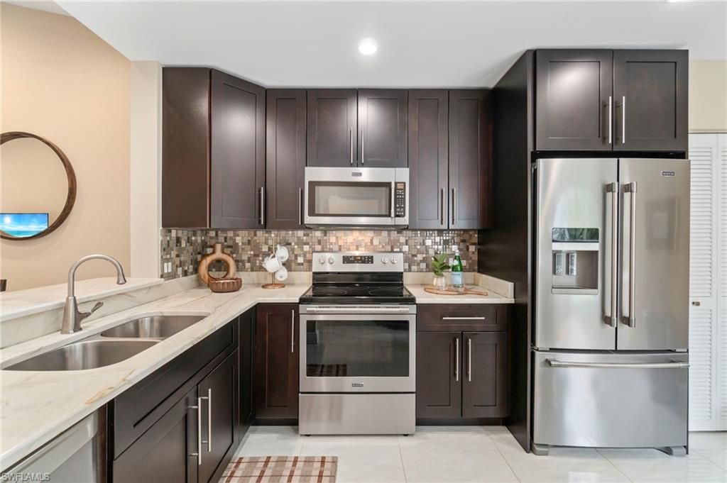 Photo of 613 Serendipity DR #613, NAPLES, FL 34108 (MLS # 226000562)