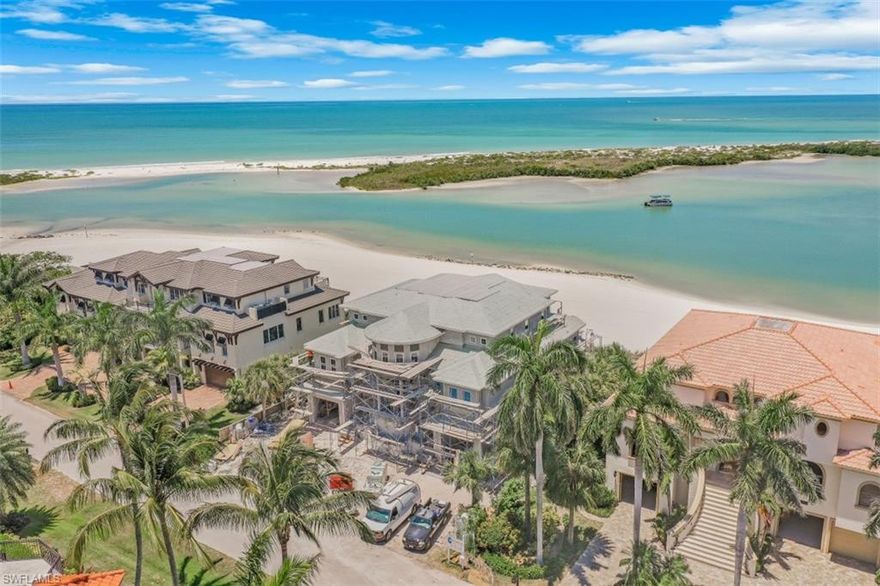 Enveloped by the simple luxuries of sun & sea, this brand new/rarely available beachfront residence is located in Hideaway Beach, Marco
Island's most prestigious gated community. This sandcastle-inspired structure (est completion April 22) custom-built by Tom Christian Construction, incorporates refined craftsmanship & luxe appointments throughout. Panoramic vistas of the sparkling beach & the Gulf's aqua waters abound throughout this elegant home. The main level's open floor plan offers easy transitions between the kitchen, dining, & living room. The spectacular beachfront master suite features a private den ideal for an office or exercise room, & luxurious master bath. Privacy is afforded w/a next-level guest floor, where a media room (possible bedroom/multi-functional room) separates two bedrooms, both w/en-suite baths. Each room offers access to the top-level outdoor balcony, an idyllic perch for watching the passing boats & birds while entertaining during sunset. Amenities include an elevator, 4-car garage, & quick access to Hideaway's community-exclusive beach club, offering 3 restaurants, pool, fitness center, tennis, pickleball, bocce, 9-hole executive golf course, & more.