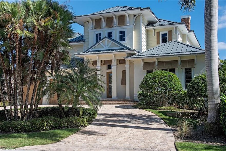 Nestled along a quiet street in the middle of downtown Old Naples sits 1061 7th Street South. This beautiful West Indies inspired single family residence offers a spacious and private outdoor living area, a large heated pool and spa, summer kitchen, and a large sunny deck complimented by a covered living area with a fireplace, perfect for entertaining. The first floor living area includes the master bedroom, a Florida great room and a gourmet kitchen along with a nice laundry room/mudroom. The second floor offers 3 en suite bedrooms and a large family room serviced by a wet bar as well as a second floor laundry for ease of living. This beautiful home is walking distance to the beach and Naples Pier as well as world famous shopping and dining on 5th Avenue South and the historic 3rd Street South shopping district.