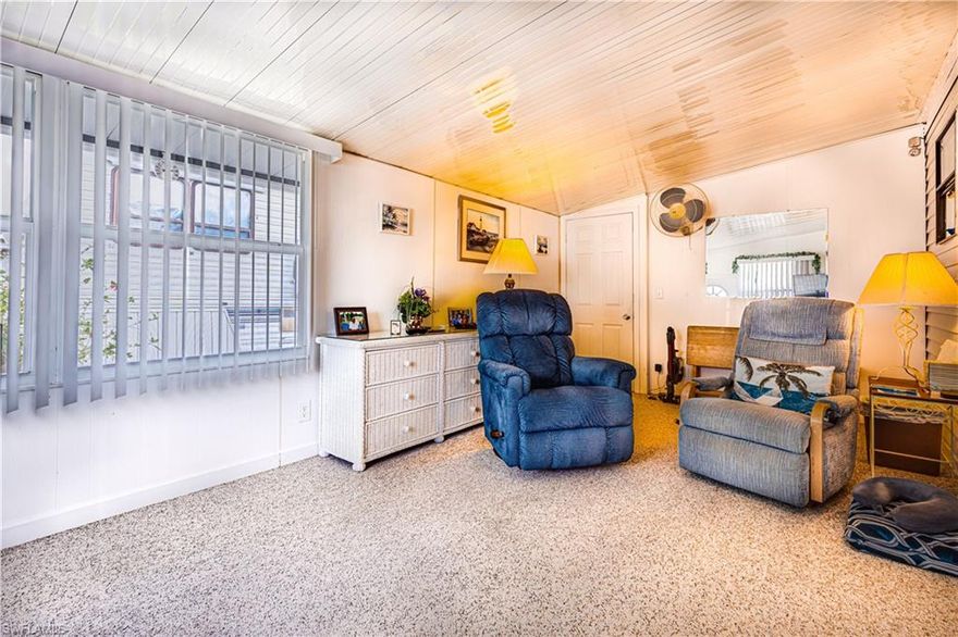 This cute little place is perfect for the retiring couple or single individual!  The lanai has been converted to a comfortable space with a half bath. When you walk in the door you feel like you're right at home. As you enter the park model side, you can see that it has been lovingly cared for and maintained with beautiful laminate floors and lots of windows to let in the wonderful SW Florida sunshine. It has a nice sized utility room with an extra closet and also has an additional storage space. The patio is perfect for picnics and has a pretty green space in the rear of the home for a lovely bonus.  Located in an active, 55 plus, gated community where you own the land.  Close to Walmart, Publix, Walgreens, CVS, and more!  It is only about 8 miles to Marco Island and about 12 to downtown Naples.  This is one you don't want to miss!