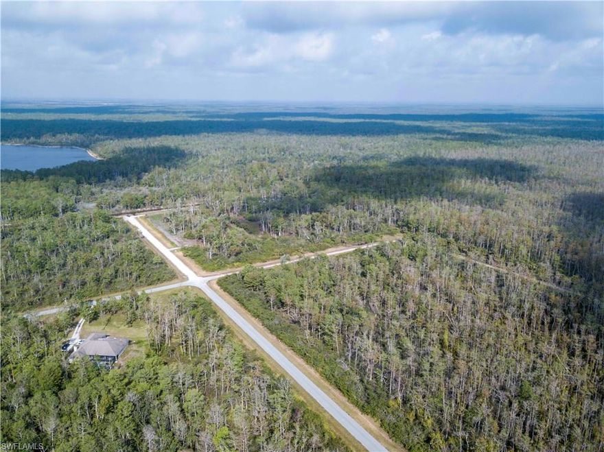 5.15 ACRES WITH 660 FEET OF CANAL FRONTAGE - 30 MINUTES FROM NAPLES WHITE SANDY BEACHES, CAN NOW BE YOURS.   15 min to Ave Maria, Bird Rookery nature trail close by, 1.5 miles to new sheriff dept and new EMS station 10.  Borders 68,000 acre Sanctuary of ancient forest land to be preserved in perpetuity. These rare parcels will never be duplicated or available again...  Has frontage on  47th Ave NW.