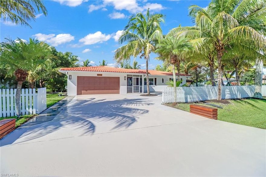 Located in Collier county just minutes from barefoot beach, tucked away on one of Bonita Shores quietest streets sits your own private oasis. Almost a half acre of mature landscaping & towering palms provide shade to enjoy outdoor living year long. This 3 bedroom 2 bath  pool home is sure to please with new appliances and a freshly updated interior. The large fenced in yard has a nice sized gate for easy access to store your boat or RV. Lot is above flood zone!!! Community has access to a boat ramp and a community room. Walking distance to some of Bonita Springs best restaurants and no rental restrictions!