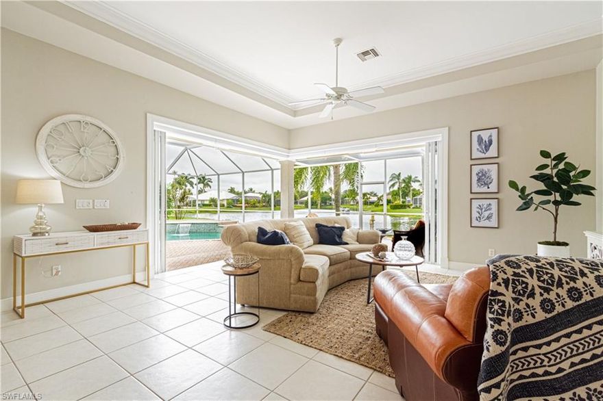 Here's the home you've been waiting for. This 4 bedroom/3 full bath Lakefront gem has it all: An updated kitchen with stainless steel appliances, pantry cabinet with pull out drawers, Spacious Open floor plan with Zero Edge slider that expands onto the oversized pavered lanai with coveted Western Exposure, Heated Pool, Lake view and private dock.  Additional features include luxury wood laminate and Tile throughout, Wet Bar, separate dining room and formal living room, plantation shutters, Arched windows, motorized and manual sun shades.  The Master Suite boasts gorgeous lake views and a master bath with walk in shower and Jetted Jacuzzi Tub.  The Ensuite Guest room also boasts an exquisite lake view.  Pavered Driveway, 2 car garage AND a large separate Air conditioned Attic space for storage. Longshore Lake is a sought after gated community in North Naples Featuring an 88 acre lake for boating, kayaking ,fishing and paddle boarding, Clubhouse with restaurant, bar and outdoor dining, swimming pool, 9 Har Tru tennis courts with full time Pro, fitness room and social activities.  Great Location and close to shops, restaurants and Beaches. Do not miss this one!