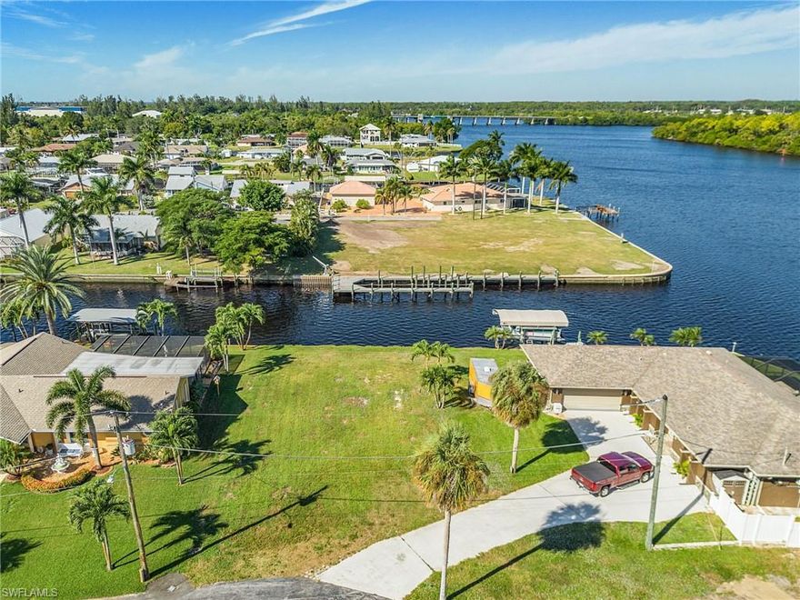 Build your WATERFRONT DREAM HOME on this exceptional RIVERVIEW GULF ACCESS/ NO BRIDGES vacant lot WITH 80' of SEAWALL frontage in FT MYERS SHORES, offering WIDE, breathtaking river views and DIRECT ACCESS to the Gulf of Mexico. This is a rare opportunity to own a piece of paradise in a PREMIER waterfront location. Enjoy quick and easy access to open water—perfect for boating, fishing, and exploring nearby islands and beaches.  Experience panoramic views of the river from your future lanai, pool, or private dock. EVERY SUNSET WILL FEEL LIKE A VACATION. Close to I75 access to international airport, hospitals, and shopping. Close to HISTORIC Downtown Ft Myers! THIS IS A BEAUTY!