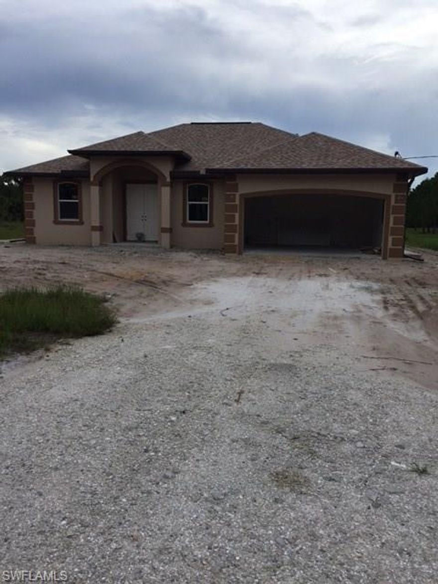 BEAUTIFUL NEW CONSTRUCTION AFFORDABLE HOME OFFERING 3+DEN WITH 2 FULL BATHS AND A 2 CAR GARAGE SITUATED ON 2.27 ACRES YES THATS RIGHT 2.27 ACRES. THIS HOME OFFERS 20X20 PORCELAIN FLOORING THROUGHOUT WITH 5 1/4 BASEBOARDS THROUGHOUT THE HOME WITH 2 PANEL BIFOLDS AND DOORS, WOOD CABINETS WITH GRANITE TOPS. 9-4" CEILINGS THROUGHOUT WITH TRAY CEILINGS IN LIVING AREA AND MASTER BEDROOM. DUAL SINKS IN THE MASTER BATH ALONG WITH A STAND UP SHOWER. LARGE LANAI UNDER TRUSSES, LAUNDRY IN THE RESIDENCE. ACT NOW THIS HOME WILL NOT LAST LONG. PROPERTY BEING SOLD AS IS WITH THE RIGHT TO INSPECT