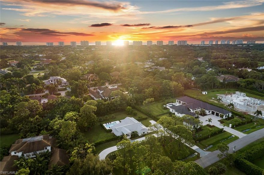 Perched high and dry in the X-flood zone, 517 Gordonia has been entirely rebuilt in 2022. This stunning home features 4 bedrooms, 3.5 baths, and over 3,600 square feet of thoughtfully designed space. Crafted with practicality in mind, it boasts high-end materials and finishes that will impress even the most discerning buyers. Interior highlights include custom cabinetry, a wet bar, built in coffee station, wide plank engineered oak flooring, a variety of elegant Calacatta Quartz surfaces, and designer fixtures and hardware throughout. Outside, you'll find a custom pool and spa with Southwest exposure surrounded by an expansive white travertine deck, complete with water features and a spacious sun shelf. Additional amenities include a whole-house reverse osmosis system, a tankless water heater, electric vehicle charging, and an ADT security system with Ring cameras. The yard has been cleared, filled, graded, and fully fenced with rows of lush Calusa hedges showcasing two mature mango trees. This home is situated amidst a wave of new construction on the street. It’s no secret that Pine Ridge is becoming the most coveted neighborhood in Naples. Since hurricane Ian Pine Ridge has been referred to by locals as “ The high and dry Port Royal.”
