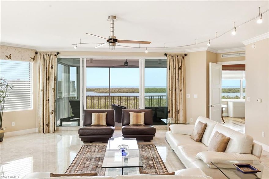 A rare find in the Dunes of Naples! This gorgeous 3-bedroom-plus-den, 3-bathroom corner unit at the Grande Geneva is the definition of luxury living.
Imagine watching the sunset over the Gulf of Mexico every evening from your own southwest corner unit in the newest building at The Dunes. A private elevator brings you directly into this beautiful, light-filled home, where your first glimpse is a breathtaking view of Turkey Bay and the Gulf. The interior is beautifully finished with a mix of elegant marble and warm wood flooring. Step out onto the lanai, which is equipped with electric storm shutters and impact windows throughout for your peace of mind. The kitchen is a chef's dream, featuring a gas stove, stainless steel high-end Monogram appliances, a wine fridge, and gorgeous granite countertops. Upgraded panel cabinetry with under-cabinet lighting and recessed lighting throughout make the space both functional and stylish. The large dining area includes a charming window seat with built-in storage, and thoughtful details like Hunter Douglas blinds, custom valances, crown molding, and high baseboards complete the polished look in the condo. In the master bathroom, you’ll find dual sinks, granite counters and a separate enclosed shower and tub combination. All of the bedrooms have custom closets. The dedicated laundry room is also well-appointed with a GE Profile washer and dryer, custom cabinets for plenty of storage, and a practical laundry tub. Life at the Grande Geneva means you have exclusive access to the building’s private pool, spa, fitness room, social spaces, and concierge services. You’ll also enjoy all the world-class amenities at The Club at the Dunes, including fine dining, a resort-style pool with a tiki bar, a state-of-the-art fitness center, tennis, and newly approved pickleball courts. This is a rare opportunity to own a home in one of Southwest Florida's most desirable communities. It's more than just a place to live—it's an invitation to enjoy the elegant, leisurely Naples lifestyle at its absolute best.