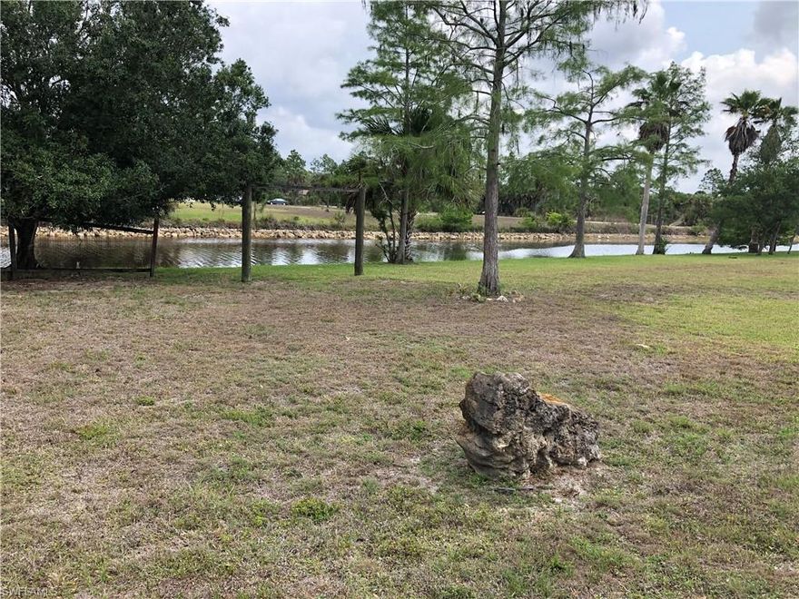 HUGE sq ft home on 5.78 acres, corner lot on the canal too!!! This is a 3 bedroom home with a den, 3 baths, tile counter tops in
kitchen, lots of cabinet space, appliances in place, minus washer and dryer, beautiful built-in in the living room and also the
family room area, one of the garage spaces has been converted so currently you have a 4 bedroom home with a den, fully
paved driveway and circular paver drive and more. Cosmetic repairs necessary but priced accordingly!