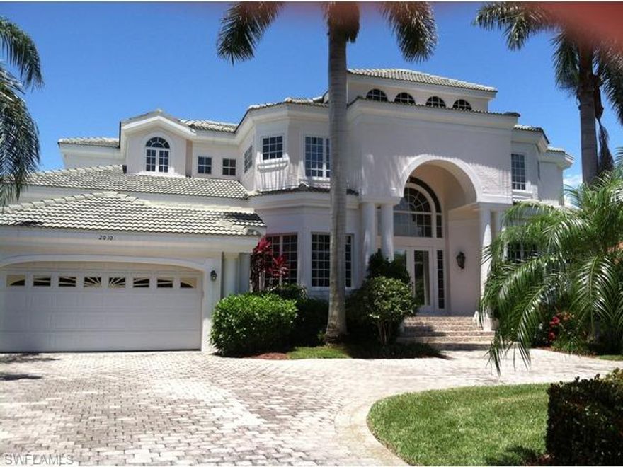 Wow! What a find once through the private gates,  just steps from the stunning sunsets on the sugar sand beach of Naples, and just seconds away from  the fine dinning and lovely shopping of 5TH Ave and 3RD St you will find your new home. Built in 1999 this lovely two story 4 bedroom and 4 .5 bath pool home offers two masters with one being on the main level. A great kitchen with new appliances,  open to family and breakfast areas. You can see open lanai offers a new summer kitchen over looking the new larger pool surround in a very private back yard with manicured landscaping  You and you family will love to entertain in this inviting back yard. Other features for your consideration would be, the tall ceilings and lots of windows flood this beautiful home with light. Each bed room with its own on suite. Formal dinning and living space not mention the den or office.  The most unique feature is the small gated community of less than a dozen homes has a private gated beach walk.