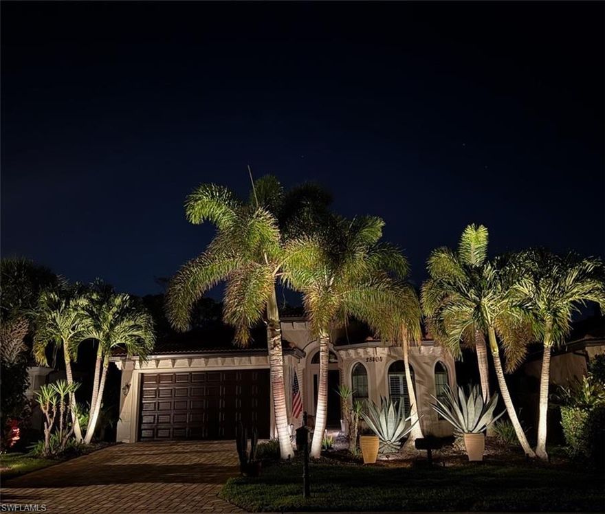 Welcome to a truly exceptional Toll Brothers residence in the heart of Bonita Springs—an upgraded, design-forward home that stands well apart from typical new-build offerings. At the center of the outdoor experience is a dramatic 17,000-gallon saltwater infinity-edge pool with four sheer descents, framed by a 1,500 SqFt hurricane-rated panoramic pool enclosure that captures sweeping northwest views. The expansive lanai is an entertainer’s retreat, featuring two illuminated marble water-wall installations, natural-gas hookup, stainless utility sink with hot and cold water, TV and hard-wired internet connections, and abundant power access—ideal for seamless indoor-outdoor living. The grounds are meticulously curated with mature, illuminated palms—including towering Royal, Christmas, and Foxtail varieties—creating a private, resort-like ambiance after sunset. Inside, the home reveals a chef’s kitchen rarely found at this price point, appointed with a Sub-Zero glass-front refrigerator / freezer, Wolf six-burner gas cooktop and hood, KitchenAid double ovens, Viking dishwasher, and an oversized 5’ x 10’ island wrapped in Snow White quartz, complemented by matching quartz countertops, backsplash, and the extensive UltraCraft cabinetry.

Architectural details include 13-foot coffered ceilings with crown molding in the main living areas, 10-foot ceilings throughout, and engineered hickory hardwood flooring in the primary suite and main living spaces. The residence is climate-controlled by a premium Bosch HVAC system with blue-light purification. The great room is outfitted with a built-in five-speaker surround system with additional speakers extending the experience to the lanai. The primary suite is a private sanctuary featuring lanai access, dual walk-in closets, and a spa-inspired bath clad in Bianco Bello and Carrara marble, complete with rain shower, built-in seating, and a soaking tub. A Carrara-marble powder room offers refined elegance for guests. Two additional bedrooms, a private office, full guest bath, and laundry room complete the floor plan.

Every window and opening is impact-rated, including sliders, garage door, and front entry. A 2022 wind mitigation inspection earned an “A” rating, and the property is not located in a flood or FEMA zone. Plantation shutters by Sunburst (lifetime warranty) add both beauty and durability throughout. Located just five miles from Barefoot Beach and Vanderbilt Beach, this home offers rare peace of mind, exceptional craftsmanship, and true resort-style living—meticulously maintained and presented in pristine condition.