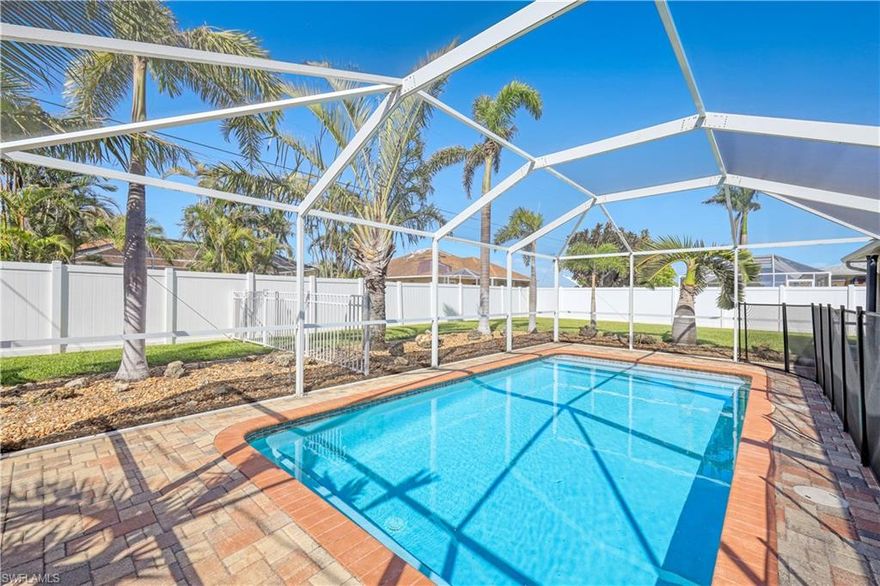 Nestled in a well-established, highly desirable area of Cape Coral, this lovely 3 bedroom + Den, 2 Bath pool home is your tropical paradise! As you enter, you are welcomed by a spacious open floor plan with a beautiful view of the lanai and fully fenced backyard. The back lanai extends the entire length of the home giving you ample covered space to entertain, w/ brick pavers, electric shutters, & pool guest bath. Enjoy the large saltwater pool, heated by electric or solar panels, & surrounded by tropical landscaping.  The kitchen has a new backsplash & appliances, & large breakfast bar. This split bedroom layout provides great privacy & huge master suite w/ walk-in closets, remodeled walk-in shower & soaking tub w/ separate vanities.  Home features a whole home Generac generator, electric & manual storm shutters, New Roof, 5-year-old AC, & many fabulous updates. Full-size washer/dryer & laundry tub. The garage features lots of cabinets, workbench, & ample storage. City water & sewer already paid in full. This home is move-in ready and waiting for you to call it your own. Don't miss the opportunity to own this beautiful pool home in the heart of Cape Coral!