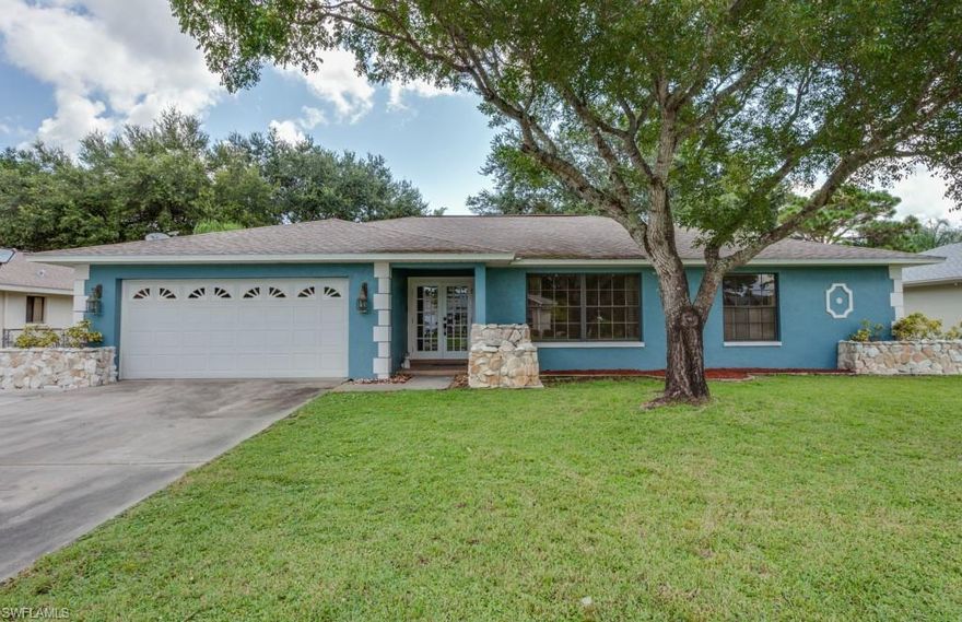 This beautiful 4 bedroom, 2.5 bathroom home located in the quiet private community of Lochmoor Villas is one your not going to want to miss.  Relax in font of the wood burning fireplace or entertain guests in your remodeled kitchen complete with Granite Counter tops and stainless steel appliances.  Retreat into your spacious master bedroom with updated master bath.  Massive backyard is great for barbequing.  Take your kayak for a dip in the canal or head over to the nearby park.  This home has all the features you've been looking for including all new flooring, new plumbing, mosaic back splash, huge master closet and tons of storage.  Come fall in love.