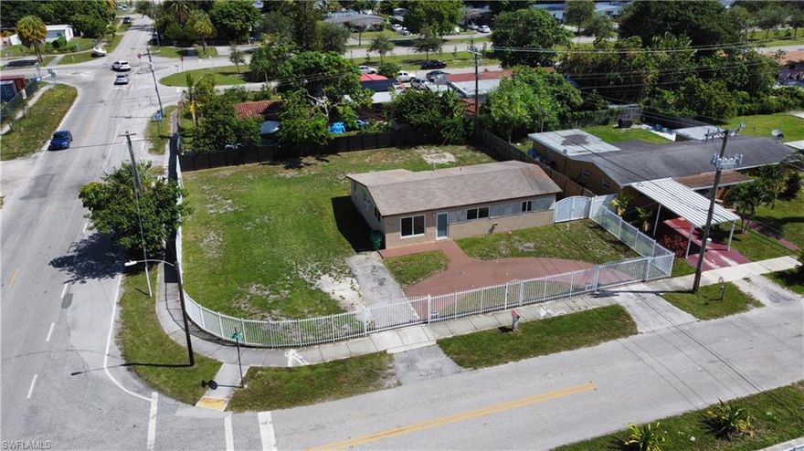 Prime property listing bordering both Dade & Broward county near schools, shopping and beaches. This 3b/2ba house sits on massive corner lot. Secured by both picket & private metal gates. Three access points which includes two motorized gates with an additional side access for larger trucks, RV's & boats. The home has been recently painted inside and out, with new base boards installed.  Bathrooms have been updated to modern walk in showers & Vanities. Tile throughout the house, recently installed hurricane impact windows & door. Inside and outside A/C units were installed new in 2018. This property is a catch and will not last long. Schedule your appointment to see it today.
