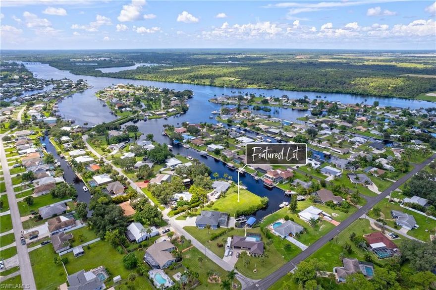 Discover one of North Fort Myers hidden gems—the perfect canvas to build your dream home. This RARE direct Gulf access lot offers an impressive 244’ of frontage and is tucked away at the end of a quiet cul-de-sac, delivering privacy, tranquility, and incredible water views. Surrounded by water on two sides with an intersecting canal setting, this cleared homesite features a newer 244’ seawall by Honc Marine Contracting. Enjoy deep water access and reach the Caloosahatchee River in seconds, with only minutes to the Intracoastal Waterway—perfect for boating, fishing, and waterfront dining. Wake up to stunning sunrises over the canal and unwind with peaceful sunsets reflecting across the water. Whether you’re planning a forever home or seasonal retreat, this property offers the ideal blend of seclusion and convenience. Located in the desirable River Forest community, you’ll appreciate no HOA fees or CDD, plus RV-friendly flexibility. City water and sewer are already in place, and assessments are paid. Residents also enjoy access to a community boat ramp and clubhouse. Just 15 minutes from shopping, dining, great schools, and easy access to Interstate 75, this location checks every box. Don’t miss this exceptional opportunity!