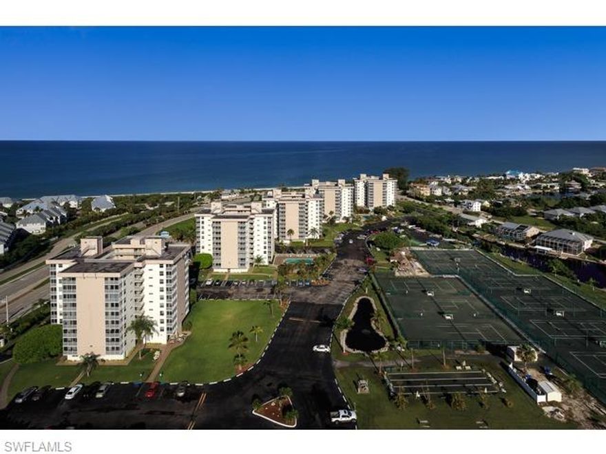 STUNNING, updated 9th floor condo in building #5 at the Beach and Tennis Club. Overlooking Fish Trap Bay and beautiful Bare Foot Beach Community. Upgrades include wrap a round kitchen, granite counter tops, Bahama shutters. Glass Block room divider lets the light flow in, but adds privacy to the sleeping area. Tiled through out.
Remodeled bath with ceramic tiled shower. Rental history available for this highly desirable unit. Plexi-glass enclosure surrounds the screened in lanai making it an all seasons extra room. Tastefully furnished, offered turn/key. The Beach and Tennis Club is located on 15 acres across from Bonita Beach. 2 deep water swimming pools , 10 Har-Tru clay tennis courts where owners or renters play free at the very popular tennis club. Boat slips for rent when available with Gulf of Mexico access. Bocce ball courts with weekly league play. Monthly Socials during season in the lobby. This totally renovated condo won't last long. It can be yours. Come see for yourself .
