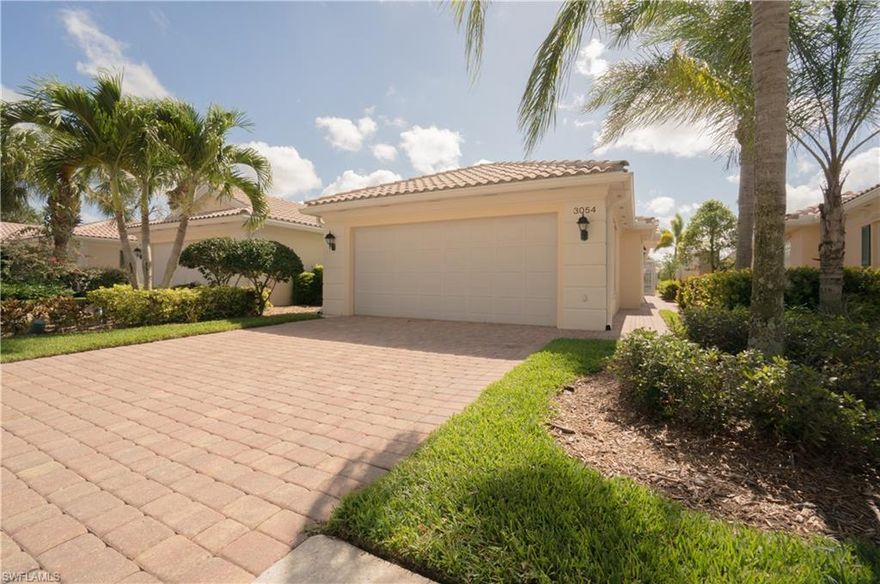 You MUST SEE this LAKEVIEW beauty! Your 2 Bedroom 2 Bath Villa with an Attached 2 Car Garage is in MINT condition and ready for you to move in. Located in the NEWER SECTION of IslandWalk, close to the Entry Gate and just a short stroll to the many amenities offered at Town Center. The LEADED GLASS ENTRY DOOR flanked by Pillars welcomes your guests and adds extra natural light to your home. Be sure to check out the PAVERED WALKWAY AROUND THE LANAI for easy access to the lake area. Easy care PLANTATION SHUTTERS, Large TILE and stylish Weathered Gray WOOD FLOORS add to the Coastal decorator touches throughout the home. Vaulted ceilings enhance the spatial quality of your Villa and the NEUTRAL PALETTE is soothing. The Open Kitchen is perfect for entertaining and the spacious caged lanai and Private POOL overlooking the tranquil Lake provides a relaxing backdrop for enjoyment of the Naples lifestyle. Extras include STORM SHUTTERS, CENTRAL VACUUM and a SECURITY SYSTEM. LOW FEES and NO CDD give you amenities galore. Minutes from our glorious Beaches, chic Mercato, Fifth Avenue and Third Street for the best in dining, shopping and entertainment. Make this your address in Paradise!