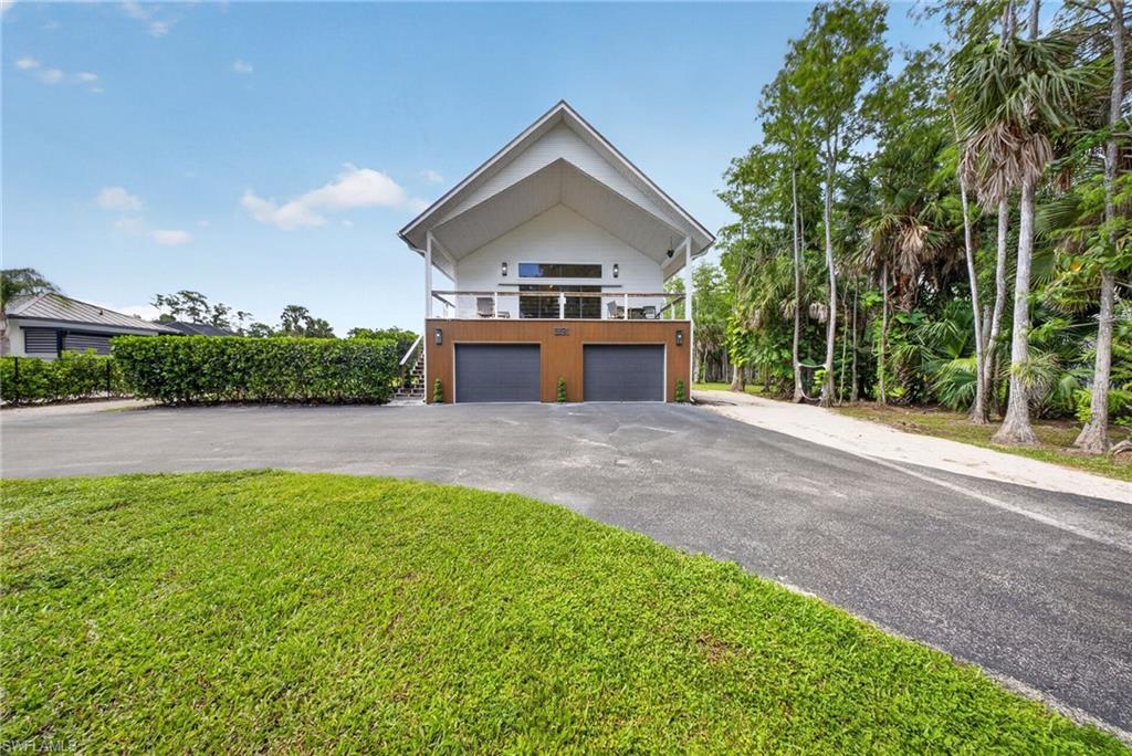 Photo of 5191 Coral Wood DR, NAPLES, FL 34119 (MLS # 226028144)