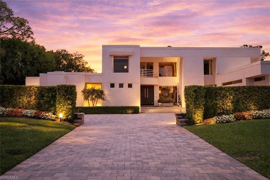 Behind the gates of the prestigious Quail Creek community, this striking two-story estate delivers a commanding blend of sophistication, scale, and true Naples luxury living. Set against lush landscaping and the manicured fairways of one of North Naples’ most established golf enclaves, the home offers exceptional privacy with an unmistakable sense of arrival. Designed for both elevated living and effortless entertaining, this expansive turnkey-furnished residence features four bedrooms, a large private office, a gym, and five bathrooms—offering a seamless, move-in-ready experience curated for a modern, high-performance lifestyle. The grand two-story design is defined by soaring ceilings, sun-drenched interiors, and fluid transitions between formal and relaxed living spaces. Carrara marble and French oak flooring anchor the main living areas, while a wood-burning fireplace adds warmth and architectural character. At the center of the home, a fully reimagined chef’s kitchen makes a bold statement—featuring a dramatic 10-foot island, new custom cabinetry, sleek quartz countertops, and a full suite of brand-new Miele appliances, including induction cooktop, double ovens, and wine refrigeration. A built-in bar further elevates the home’s entertaining appeal. The first-floor primary suite is a private sanctuary, complete with a spa-inspired bath featuring a glass-enclosed design and custom closets. Throughout the home, modern upgrades such as new hurricane impact door walls and sliding glass barn doors add both style and functionality. Pocketing sliding glass doors create a seamless indoor-outdoor experience, opening to a true resort-style setting. The outdoor living space is designed for year-round enjoyment, featuring a gas-heated pool and spa with a new pool heater, along with a fully equipped outdoor kitchen complete with grill, refrigerator, and gas cooktop. This home has been extensively upgraded for comfort, efficiency, and peace of mind, including a brand-new roof, two new HVAC systems, a garage mini-split A/C, freshly painted interiors, and an integrated Arlo security system. The garage is equally refined with new epoxy flooring and custom cabinetry. Offered fully turnkey, every detail has been thoughtfully curated allowing for an immediate, effortless transition into luxury living. Life in Quail Creek is defined by exclusivity and lifestyle. Optional membership unlocks 36 holes of championship golf, a newly renovated clubhouse, and a vibrant social scene. Residents enjoy access to world-class amenities including a spa, fitness center, tennis, pickleball, bocce, and exceptional dining. Perfectly positioned in North Naples, just minutes from Mercato, Waterside Shops, and the Gulf’s pristine beaches, this residence delivers a rare combination of privacy, power, and polished luxury.