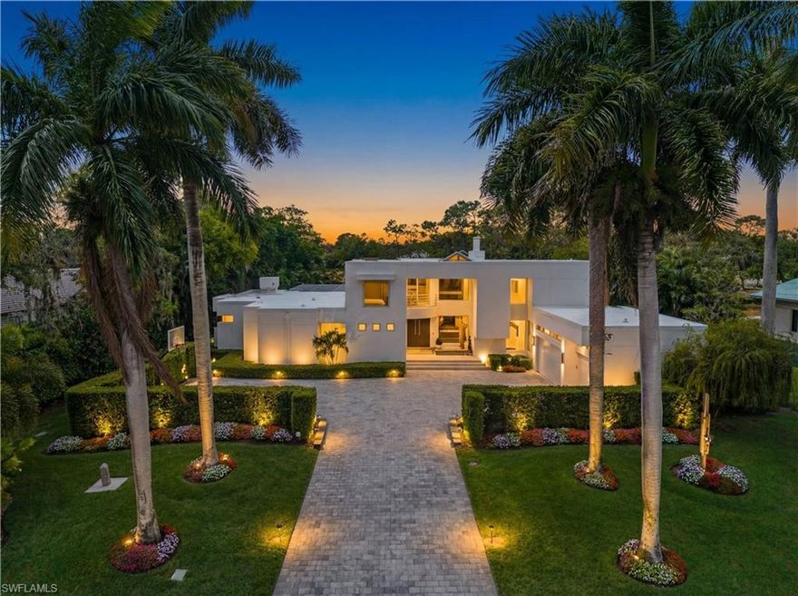 Behind the gates of the prestigious Quail Creek community, this striking two-story estate delivers a commanding blend of sophistication, scale, and true Naples luxury living. Set against lush landscaping and the manicured fairways of one of North Naples’ most established golf enclaves, the home offers exceptional privacy with an unmistakable sense of arrival. Designed for both elevated living and effortless entertaining, this expansive turnkey-furnished residence features four bedrooms, a large private office, a gym, and five bathrooms—offering a seamless, move-in-ready experience curated for a modern, high-performance lifestyle. The grand two-story design is defined by soaring ceilings, sun-drenched interiors, and fluid transitions between formal and relaxed living spaces. Carrara marble and French oak flooring anchor the main living areas, while a wood-burning fireplace adds warmth and architectural character. At the center of the home, a fully reimagined chef’s kitchen makes a bold statement—featuring a dramatic 10-foot island, new custom cabinetry, sleek quartz countertops, and a full suite of brand-new Miele appliances, including induction cooktop, double ovens, and wine refrigeration. A built-in bar further elevates the home’s entertaining appeal. The first-floor primary suite is a private sanctuary, complete with a spa-inspired bath featuring a glass-enclosed design and custom closets. Throughout the home, modern upgrades such as new hurricane impact door walls and sliding glass barn doors add both style and functionality. Pocketing sliding glass doors create a seamless indoor-outdoor experience, opening to a true resort-style setting. The outdoor living space is designed for year-round enjoyment, featuring a gas-heated pool and spa with a new pool heater, along with a fully equipped outdoor kitchen complete with grill, refrigerator, and gas cooktop. This home has been extensively upgraded for comfort, efficiency, and peace of mind, including a brand-new roof, two new HVAC systems, a garage mini-split A/C, freshly painted interiors, and an integrated Arlo security system. The garage is equally refined with new epoxy flooring and custom cabinetry. Offered fully turnkey, every detail has been thoughtfully curated allowing for an immediate, effortless transition into luxury living. Life in Quail Creek is defined by exclusivity and lifestyle. Optional membership unlocks 36 holes of championship golf, a newly renovated clubhouse, and a vibrant social scene. Residents enjoy access to world-class amenities including a spa, fitness center, tennis, pickleball, bocce, and exceptional dining. Perfectly positioned in North Naples, just minutes from Mercato, Waterside Shops, and the Gulf’s pristine beaches, this residence delivers a rare combination of privacy, power, and polished luxury.