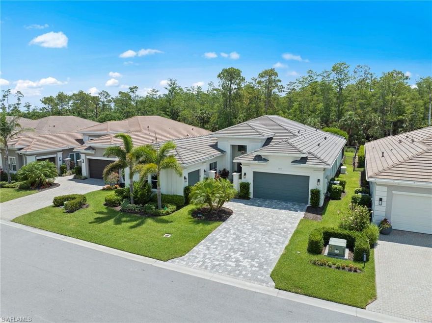 Experience luxury living in this exquisitely upgraded 4-bedroom, 3.5-bathroom Carlyle in Bonita Springs most luxurious 55+ community, Valencia Bonita. Offering 3,102 square feet of elegant interior space, this residence is filled with thoughtful, high-end enhancements throughout.

The impressive exterior features upgraded front and lanai lighting, with a custom fixtures, Storm Smart hurricane protection, and a Generac whole-home generator for peace of mind. The extended lanai is an entertainer’s dream with a full outdoor kitchen, 65” TV, pool and spa, fenced yard, and picture window screen enclosure overlooking a lush Eastern facing Preserve view. 

Inside, sophistication meets function with crown molding, fresh designer paint, rich dark gray doors, and daylight LED lighting. The gourmet kitchen includes GE appliances, a designer backsplash, and upgraded lighting, while the great room showcases a detailed custom ceiling, upscale fixtures, built-in entertainment wall, electric fireplace, and 75” TV. A stylish wet bar with a wine fridge and custom finishes complements the coffered-ceiling dining room and wine cabinet.

The primary suite is a private retreat with blackout power shades, coffered ceilings, dual triple-decked closets, upgraded carpet, and a spa-like bath featuring a sliding barn door, upgraded fixtures, and roll-out shelving. The office/4th bedroom is fully outfitted with a closet, TV, accent wall, motorized shades, and ceiling fan. Each guest room showcases custom ceiling details, TVs, power-shaded windows, and elegant finishes. Both guest baths are equally refined with upgraded faucets, wallpaper accents, and pull-out cabinetry.

Additional highlights include an epoxy-coated garage with built-in storage and an extra fridge, a well-appointed laundry room with custom built-ins, Samsung appliances, and countless designer upgrades inside and out.