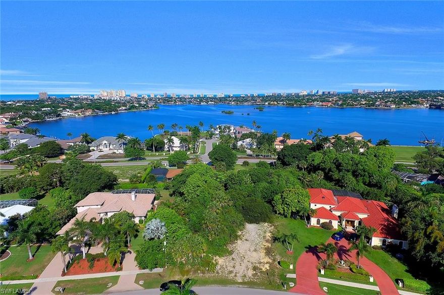 Build your custom dream home on this fantastic unique over-sized estate lot with Western exposure and higher elevation. Possible views of Roberts Bay and the Marco Island skyline from a two story home. Located in the prestigious sought after estate area this lot is wider in the rear for more expansive views. Sewer assessment is paid.