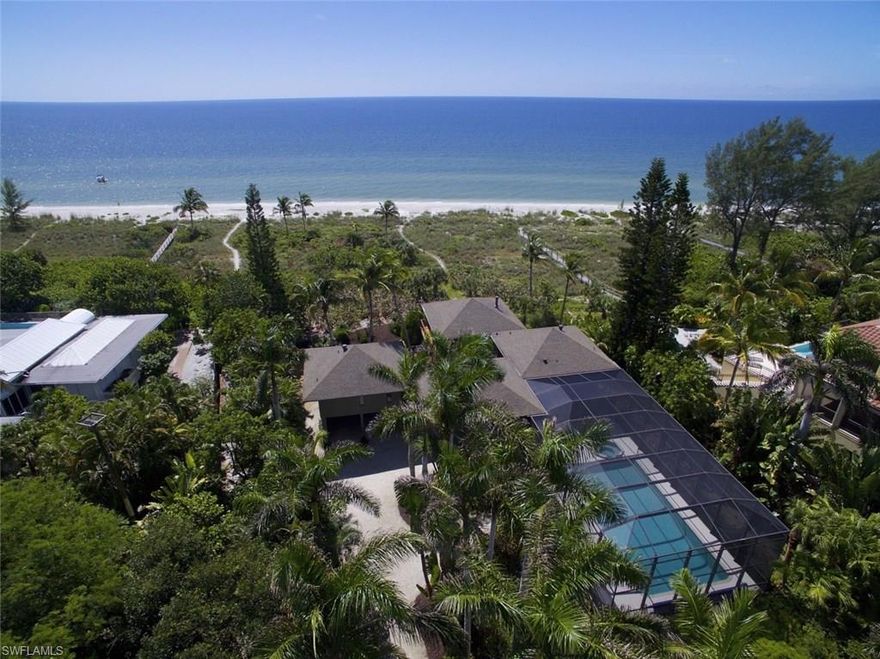 A tropical oasis meandering through beautiful mature palms to a magical location on Sanibel Island. 135' of gorgeous and prime Gulf Of Mexico beachfront situated on exclusive West Gulf Drive. Awe-inspiring pod style beach house meticulously and lovingly maintained by owners for over 25 years. Multiple guest areas with en-suites flow out to a stunning and grand deck offering dramatic beach vistas. Awesome pool and spa within a spacious screened area. Elevator. Brilliant tongue and groove wood ceilings in family room showcasing breathtaking water vistas. Privacy abounds within this incredibly superb property.