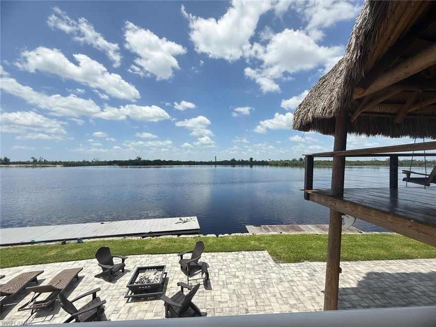 Welcome to your private waterfront paradise. A rare opportunity to own a stunning riverfront home with direct Gulf access and breathtaking views of the Caloosahatchee River. This beautifully 3-bedroom, 2-bath + office residence offers an open-concept layout filled with natural light. With elegant quartz countertops in kitchen and bathrooms, spacious open layout perfect for entertaining, Dedicated office space — ideal for working from home, Impact-resistant hurricane windows and sliding doors for peace of mind, elevated construction on concrete piles — enhancing safety and helping reduce flood insurance costs. 
 Outdoor Living at Its Finest with 252 feet of water frontage with direct Gulf access, a 25-ft wide dock — perfect for boating enthusiasts, outdoor kitchen for entertaining, spectacular two-story tiki hut featuring a quartz-lit bar and panoramic river views, a true tropical oasis with some of the best sunsets in Southwest Florida.
This one-of-a-kind waterfront retreat combines privacy, and functionality, with massive parking area for up to 20 vehicles, EV charging connection + RV hookup and no HOA to enjoy total freedom with your property.
 Live where every day feels like a vacation!