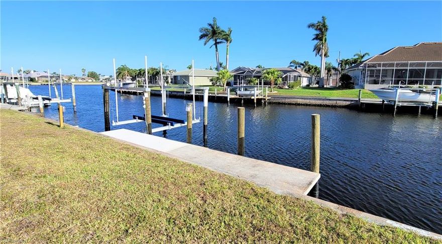 PUNTA GORDA ISLES WATERFRONT – Build Your Dream! Ready to live the Punta Gorgeous lifestyle? JUST REDUCED! This improved waterfront lot is a golden opportunity with sailboat access through Buckley’s Pass — reaching Charlotte Harbor and the Gulf in under 10 minutes! Enjoy over 84 feet of water frontage, complete with an extended 30’ concrete dock, 9,000 lb. boat lift, and generator-ready electric. Wide canal views open to a sparkling basin, giving your backyard a beautiful waterview. Seawall maintained by the City....Public utilities already in place....No HOA – optional Civic Association membership if you’d like to connect with neighbors....Prime location in one of Punta Gorda’s premier deed-restricted communities From your dock, it’s minutes to boating, fishing, beaches, and islands. On land, enjoy nearby shopping, dining, golf, pickleball, biking trails, and year-round sunshine. Your Florida dream home starts here...call today for a list of trusted builders and start making it a reality!