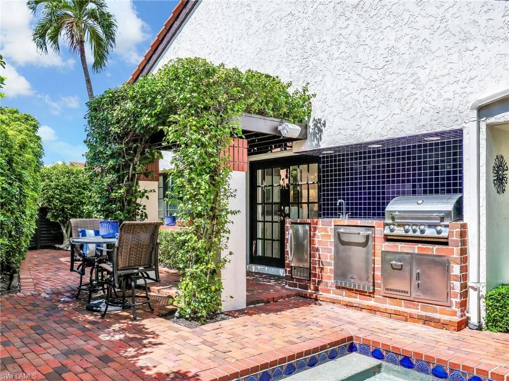 Photo of 541 Bay Villas LN, NAPLES, FL 34108 (MLS # 225072443)