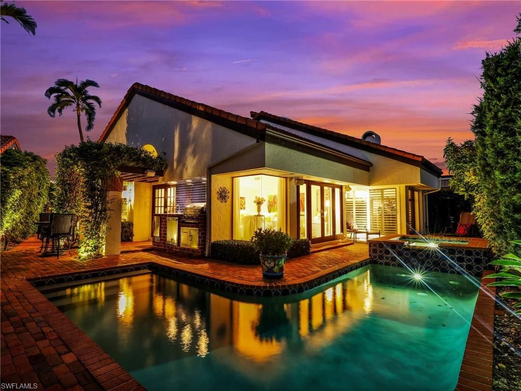 Photo of 541 Bay Villas LN, NAPLES, FL 34108 (MLS # 225072443)