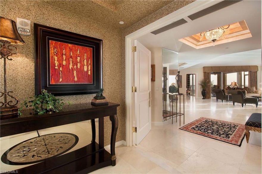 C.12233 - UNDENIABLEY DISTINCTIVE, a luxury residence in the sky with unobstructed views offering exquisite turnkey convenience.
Lightly used, this unit has travertine marble, electric sunshades, an Ultra Aire filtration system, surround sound wiring/speakers throughout, storm shutters and 2 perfect parking places. Building amenities include beautiful zero edge pool, spa, fitness, library, card room, billiards, 2 tennis courts, A/C bike room. Gated with 24/7 manned security and reception desk.  Pelican Bay world class private amenities include 2 beach clubs with indoor/outdoor dining, lounge and umbrella service, kayaks/canoes, 18 tennis courts and more. Public within Pelican Bay is Artis-Naples Philharmonic, Baker Museum of Art, Waterside Shops anchored by Saks and Nordstrom, two 5 Star hotels, restaurants and more.