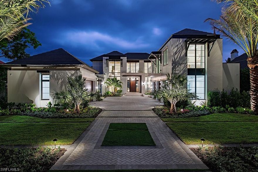 Now Completed! This extraordinary estate, masterfully designed by Stofft Cooney Architects, constructed by the esteemed A. Vernon Allen Builders, and exquisitely curated by Finding Sanctuary, offers nearly 8,200 square feet of refined, air-conditioned living space. Inside, five en suite bedrooms provide luxurious comfort, including a private guest retreat with its own lounge and a flexible gym with a full bath—ideal for conversion into a sixth bedroom if desired. The expansive first-floor master suite is paired with an oversized office/clubroom, perfect for work or unwinding in style. The residence features three laundries, 80kW whole-home generator. Designed for both relaxation and grand entertaining, the outdoor living space is truly exceptional. A rear patio fully enclosed by motorized screens and shutters allows for year-round enjoyment, while the resort-style pool with swim-up bar invites ultimate leisure. Take in stunning western sunsets over Smuggler’s Bay from the spa or expansive covered terrace. A true haven for self-proclaimed sommeliers, the home includes a walk-in wine cellar, perfect for storing and showcasing your finest vintages. Car enthusiasts will appreciate the five-bay garage, tailored for prized collections. This is an immediate Port Royal membership eligible property—offering not just a home, but an unparalleled lifestyle in one of Naples’ most coveted communities.