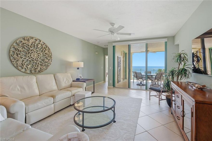 Enjoy breathtaking Gulf and beach views from this beautifully maintained residence in the prestigious, gated beachfront community of Cape Marco. Positioned with sought-after southwest exposure, this light-filled three-bedroom, two-bath condominium offers a spacious and functional layout designed to capture stunning sunsets and panoramic water views from nearly every room. Soaring 9-foot ceilings and full-height glass create an open, airy ambiance, while the expansive terrace serves as a seamless extension of the living space, ideal for outdoor dining, entertaining or simply relaxing while taking in the sweeping coastal vistas. The living and dining areas flow effortlessly to the balcony, enhancing the home’s indoor-outdoor lifestyle. Tastefully furnished in a neutral palette with coastal-inspired accents, the residence conveys a warm, inviting atmosphere throughout. The fully renovated kitchen showcases style and functionality, featuring Bosch stainless steel appliances, custom cabinetry, recessed lighting and beautiful Gulf views. Adjacent to the kitchen, a comfortable family room provides an additional gathering space ideal for casual living, movie nights or hosting guests. The spacious primary suite is a private retreat, offering direct balcony access and tranquil beach and Gulf views. The fully renovated en-suite bath features high-end finishes, including dual vanities, a spa-inspired walk-in shower, a soaking tub and a generous wardrobe closet with custom built-ins. Two additional guest bedrooms are thoughtfully positioned to offer comfortable accommodations for family and visitors, with access to a beautifully updated full bath. Additional highlights include a dedicated laundry room with LG front-loading washer and dryer, built-in cabinetry and a utility sink, along with meticulous upkeep throughout the residence. Residents enjoy an exceptional lifestyle with access to outstanding building amenities, including a resort-style pool, fitness center, clubroom with a bar, full catering kitchen, extra storage and an active social calendar. Cape Marco offers a private, gated beachfront setting with its clubhouse, additional fitness facilities, saunas, six Har-Tru tennis courts, a fishing boardwalk and scenic paver walkways along the Gulf. This is a rare opportunity to experience refined beachfront living in one of Marco Island’s sought-after communities.