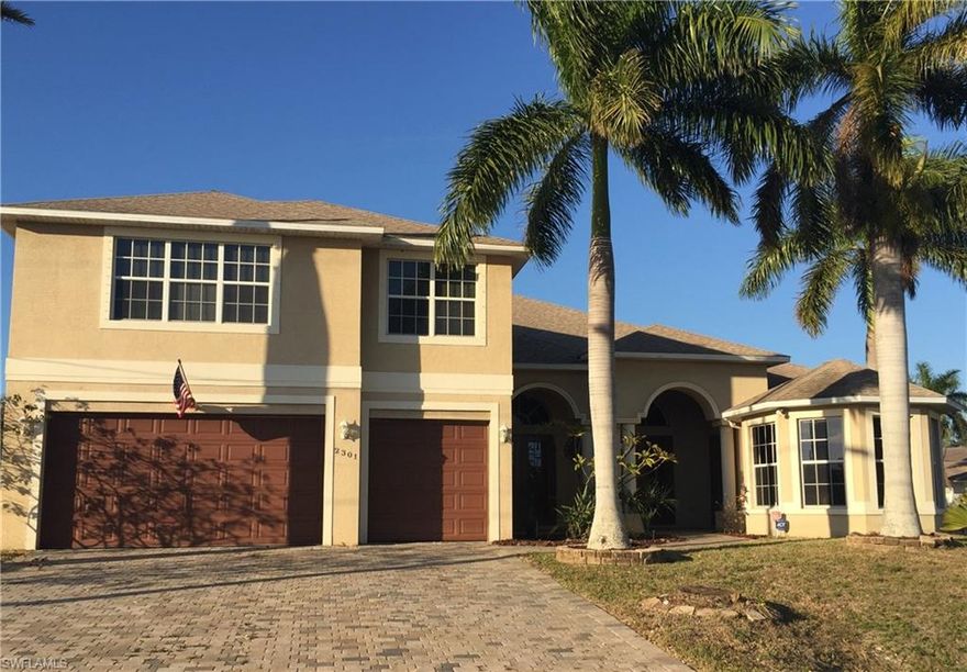 **HUGE PRICE REDUCTION!! SELLER WANTS IT SOLD!! HURRY BANK APPROVED SHORT SALE ! BRING OFFERS ASAP! Wonderful, Custom, Pool Home with 5+Den bedrooms, 3 1/2 baths in SW Cape Coral. Assessments PAID. Awesome Family Room with Built in Entertainment Wall. Gorgeous Custom Kitchen with Granite Countertops, Nice Cabinetry, Under Cabinet Lighting, and Stainless Steel Appliances. This Beautiful Home also has a separate Breakfast or Informal Dining Area and Formal Dining Room plus a Den which is used currently as a Home Office. 1st floor also has the Master Bedroom, Master Bath featuring a Champagne Bubble Bathtub and Large separate Shower with 3 shower-heads, 2 additional Bedrooms, Powder Room/Half Bath, TV Room and Full Bath. The Second Floor has 2 Bedrooms with 1 Full Bath, plus a fantastic Entertainment Area with Built in Bar and Cabinetry. The Soaring Two Story Screened Enclosure overlooks the Outside Patio, Heated Inground Swimming Pool and the Spa which is Perfect for Outdoor Entertaining! PLUS there is a Second Floor Screened Tiled Balcony to Enjoy! 3 Car Attached Garage. Security System. This Special Home is a Must See! Schedule your Showing Today!