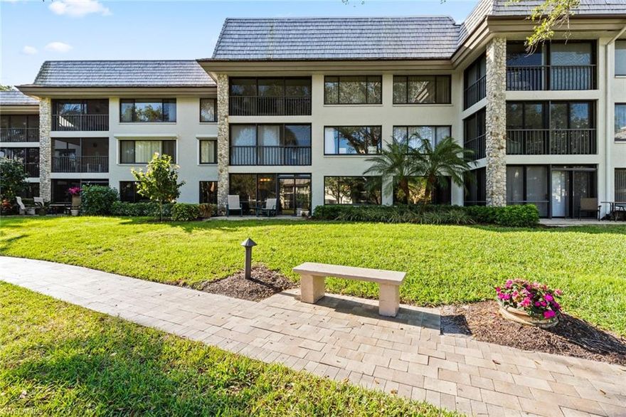 Enjoy beautiful majestic views of the fountain and lake from the living area and kitchen of this ground level home. Remodeled creating a larger enclosed living area.  Updated kitchen with top of the line appliances, granite countertops. Natural light offers a cheerful and welcoming atmosphere. Covered parking and large storage for toys, bikes and beach items.  The sanctuary consists of 5 residential buildings offering private pool, and natural areas. Short walk to Pelican Bay foundation, beach tram, main tennis facility, Artis-Naples, Waterside shops as well as walking and biking trails abound through out the area.  Pelican Bay offers a luxury lifestyle with exclusive amenities including beach services, tennis courts, pro shops, full service fitness center, community center, wellness studies and beachfront restaurants. What a life style.