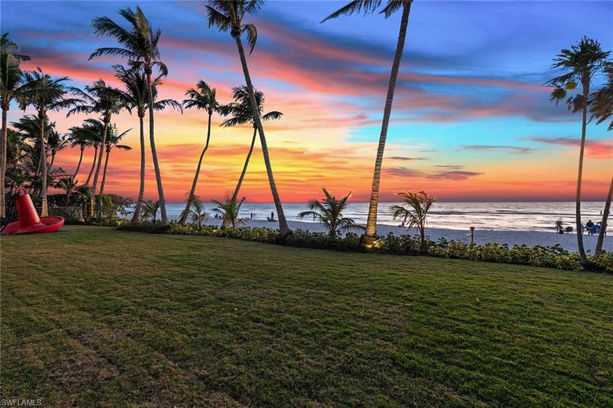 An extraordinary Old Naples beachfront estate, this rare offering encompasses approximately .67 acres with an impressive 169 feet of pristine Gulf frontage, delivering an unparalleled combination of privacy, scale, and a prime location just blocks from the world-class boutiques, galleries, and dining of Fifth Avenue South and Third Street South. Designed by acclaimed architect Richard Morris, the art deco–inspired residence was masterfully conceived to frame sweeping Gulf views and sunsets, showcase fine art and create a seamless indoor–outdoor living experience that feels grand and intimate. A dramatic arrival unfolds into a soaring 22-foot foyer, where a sweeping staircase and private elevator lead to an elevated art gallery, immediately establishing the home’s architectural presence and refined elegance. The light-filled great room serves as the heart of the residence, flowing effortlessly into the dining area, expansive lanai and a sophisticated lounge highlighted by custom millwork and a wet bar, ideal for entertaining against a backdrop of endless blue horizons. A sculptural spiral staircase ascends to a private observation deck, offering breathtaking panoramic views of the Gulf and unforgettable sunsets. The generous kitchen suite is designed for effortless hosting, featuring an open-concept layout with indoor and outdoor dining counters, a walk-in pantry and high-end stainless-steel appliances. The primary suite is a secluded beachfront retreat with direct access to a Gulf-front balcony, pool and lanai, complemented by a spa-inspired bath with a glass-enclosed walk-in shower and mesmerizing water views. Just a short distance away, a private bedroom or den offers flexibility as a refined home office or serene sanctuary. The east wing of the home hosts four spacious en-suite bedrooms and a dedicated laundry, while the northeast bedroom, bathed in exceptional natural light with abundant storage, lends itself beautifully as an artist’s studio or creative space. Outdoors, an elevated screened courtyard and lushly landscaped gardens create a tranquil oasis for year-round enjoyment, while the expansive covered lanai, complete with a kitchenette and dining area, invites relaxed coastal entertaining. Built with exterior block construction, a first-floor elevation exceeding 19 feet above NGVD and electric storm shutters, the home offers exceptional peace of mind along with enduring quality. Professional landscaping, architectural lighting, and iconic outdoor sculptures complete this remarkable setting. Beyond its immediate beauty, the property also presents an extraordinary future opportunity, with the potential to create a 10,000–15,000 square-foot custom beachfront estate, making this a once-in-a-generation offering that blends luxury, lifestyle and limitless possibility in one of Naples desired beachfront locations.