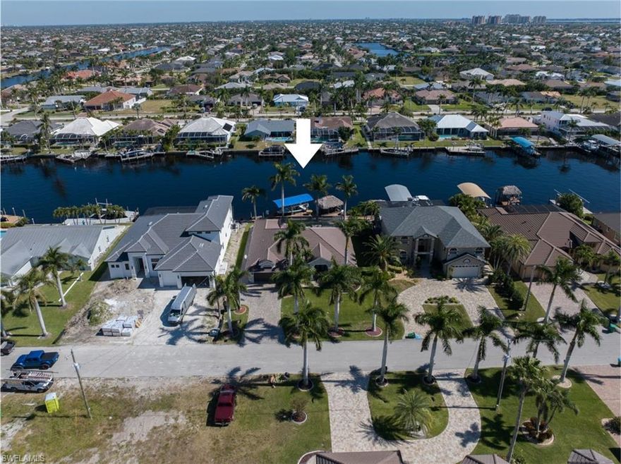 Peninsula Pointe - one of the most exclusive neighborhoods in Southwest Cape Coral !!  You will love this beautiful gulf access (no bridges) home on 200 foot wide canal!  Enjoy the views from the moment you enter the bright & open great room, large chef ready kitchen w/granite counters, plenty of cabinets, large breakfast bar as well breakfast room overlooking pool/water. Home has also formal dining (currently used as sitting area).  Spacious master bedroom w/tray ceiling, sliders to lanai & updated spa-like master bath w/stand alone tub, tiled w/i shower, double sinks & two w/i closets. Ample size guest bedrooms w/updated guest bathroom. Inside laundry & double garage w/great storage. New tile roof 2023, new pool cage 2022,  Paradise seems easy while relaxing on this expansive screened lanai w/refreshing pool, outside kitchen & plenty of sunbathing room.  Walk down to the extensive composite boat dock with 12K boat lift, boat canopy & picturesque tiki hut to savor & enjoy waterfront living. Imagine jumping into your boat from your backyard & heading out for some of the best fishing & ability to go anywhere in the world! Sunshine, palm trees & waterfront living - this is the life!
