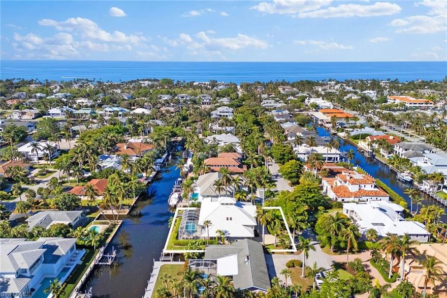 BUILT TO FEMAS LATEST ELEVATION CODE. Inviting Aqualane Shores waterfront home, prime location and endless potential. With a large open floor plan, high ceilings and plenty of room for personalization, this spacious, light-filled four-bedroom, 3.5-bath home offers an exceptional opportunity to update and create your dream waterfront property. The home features a new roof installed in 2020 and boasts a southern-facing screened-in pool with a spa, overlooking the canal. Enjoy direct gulf access via your private boat slip, with no bridges in between, ideal for boaters and water enthusiasts. Positioned just two blocks off 3rd Street South in Old Naples, you’ll have easy access to world-class dining, boutique shopping, charming cafes and more. Beach access is only five blocks away! This property offers the ideal blend of serene waterfront living and proximity to the best downtown Naples has to offer.