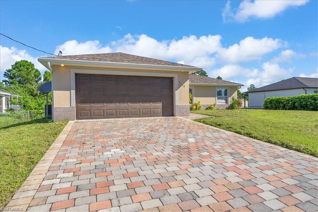 Photo of 3110 42nd ST W, LEHIGH ACRES, FL 33971 (MLS # 226016212)