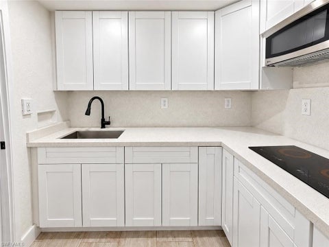 Photo of 4050 Golden Gate PKWY #219, NAPLES, FL 34116 (MLS # 226037630)