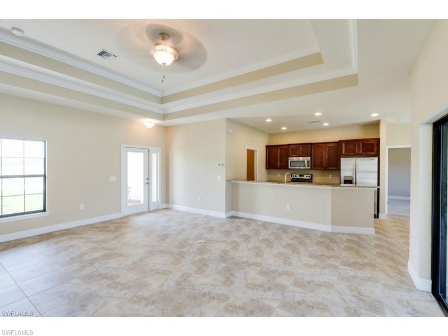 This house has everything you want in SW Florida Living.  Enjoy your sunrises while you sit enjoying the sun on your pool as you gaze across the water.  This 3 bedroom/2 bathroom home has everything you are looking for.  Open floor plan with 18" ceramic tile spanning across your double tray, crown molded ceiling in your greatroom.  Your kitchen features Stainless steel appliances, granite counter-tops, walk-up bar, and a separate breakfast nook.  Master bathroom features a double granite sink and roomy stand up shower with ceramic tile up the wall and stone tile on the floor.  Enjoy your boat ride out to the many lakes and miles upon miles of canals.  The guestbath acts as a pool bath with its own tile walkway leading from the pool to the bathroom.  Super large lanai and brick pool deck make this the house for entertaining.  Come see it today!