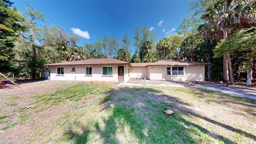 PRICE REDUCED * Builder / Handyman Special, Located Close in on a Five Acre 329 foot x 666 foot wooded lot (AH & X500 Flood Zone) in desirable Golden Gate Estates with Northern Exposure – Offered for sale by the original owners, the 1977 built concrete block construction 3/2 house with 1994 wood frame additional in-law suite and new 2023 roof is positioned up front with plenty of room to create a Family Compound / build an additional building, barn, arena, stalls, RV Garage, guest house, Main House in the back, or modify / tear down and build your dream home on this hard to find 5 wooded acres, offering additional privacy to the rear of the property.  This multiuse property is a blank canvas, Sold AS-IS with right to inspect, so bring your vision and dreams. Homesteaded Property. Recent Updates: 8 windows replaced in 2021, Roof re-shingled in 2024, AC unit replaced in 2021.  Local Schools: Big Cypress Elementary School, Oakridge Middle School, Golden Gate High School. Walk to the stores, White Blvd has a walking / jogging path.  This large property offers peace, tranquility and convenience, with easy access to essential stores and amenities; so as to fully enjoy the Southwest Florida Lifestyle in addition to our famous SWFL Sunsets.  Multigenerational Home with in-law suite is located close in, just off Collier Blvd (CR 951).  There is plenty of room for Guest House / Workshop / Horse Stalls, RV, Boats, Trailers, and all your Toys, with no HOA fees or Condo Commandos in the Golden Gate Estates neighborhoods.  Horses are OK.  Floor plan, features sheet and survey are available.  Bring your offer today on this Priced to Sell Home.  Property Address is 3501 White Blvd, Naples, FL 34117 for GPS.  There is a yard sign to help locate.  HT271