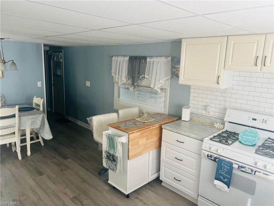 Simple Life in Paradise Awaits! Discover this charming furnished 1-bedroom, 2-bath villa with a bonus space that can serve as a den or guest room. Ideally located just minutes from the beautiful Gulf beaches of Naples and Marco Island, close to shopping, dining, and entertainment. Perfect for boat lovers — the community offers a boat ramp with Gulf access! Enjoy the 55+ Holiday Manor lifestyle with amenities like a clubhouse, pool, and shuffleboard, all with low HOA fees of just $170/month. Experience the simple life in paradise — schedule your private tour today! BUYERS NEEDS A 700+ CREDIT SCORE.