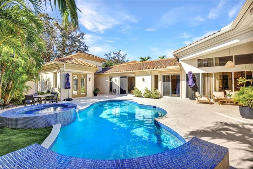 Rare opportunity to own a courtyard pool home in Grand Isle of Pelican Marsh, a private gated enclave of homes within just minutes to the fabulous sugar sand beaches, shopping, dining, and entertainment. The entrance of the home opens into a thoughtfully designed spacious courtyard with a gorgeous pool and a spa. The main house has 4 bedrooms with a total of 3.5 bathrooms and offers single-level living. The primary suite boasts volume ceilings, french doors that open to the pool area, walk-in closets, dual vanities, soaking tub, and separate shower. Also among the many luxury features are a formal living and formal dining area with crown molding, soaring ceilings, and opens onto a large 10x27’ screened lanai with expansive golf course views. Sliders in the great room and guest bedrooms all open into the courtyard pool area for true indoor/outdoor living. Enjoy a detached casita with a full ensuite bathroom and wet bar that is perfect for allowing privacy for your guests. Large laundry in the main home, and a two-car garage with ample storage. Extensive upgrades have been made including a new roof and gutters 2022, Electric roll-down and fabric shutters in 2022, a new pool heater, pumps, lighting, salt system, and decking in 2023, automatic iMist mosquito/bug system for courtyard in 2022, 2 new HVAC system in 2021 with 3 zone climate control, fiber optic to house and cabana, multi-zone in-ceiling speakers, outdoor shower, and whole-house propane Generac generator along with a 250 gallon buried tank which heats the generator, pool heater, and gas grill. Home is high and dry and not in a flood zone. Pelican Marsh offers beautifully landscaped grounds and state-of-the-art amenities including tennis, pickleball, bocce ball, attended fitness facility w/daily fitness classes, spa services, bocce, restaurant, and many social activities. Golf is optional. Be sure to view the virtual tour and request a private tour for the ultimate resort-style living experience!