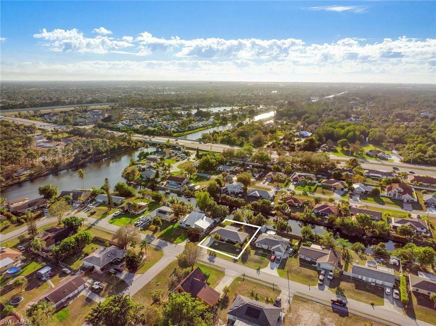 Canal living in the most sought after area of Golden Gate City is now available! This freshly painted and crisp 3 bedroom, 2 bath home comes with all the stops!  From the entryway, you are immediately greeted by the abundant living room followed by the spacious dining area.  The upgraded kitchen with natural light, stainless steel appliances, granite, large counter and cabinet space will please the most discerning of chefs. From the living area and kitchen, enjoy sunsets with western exposure in your private and enclosed lanai.  The large primary bedroom is equipped with 1 vanity with upgraded countertops.  Upgrades include but are not limited to new carpeting, one car garage, and a new roof as of 2019.  Centrally located in the Southwest corner of Golden Gate City, enjoy all the amenities Naples has to offer with top rated schools and is a stone's throw away from I-75 and Santa Barbara Blvd.