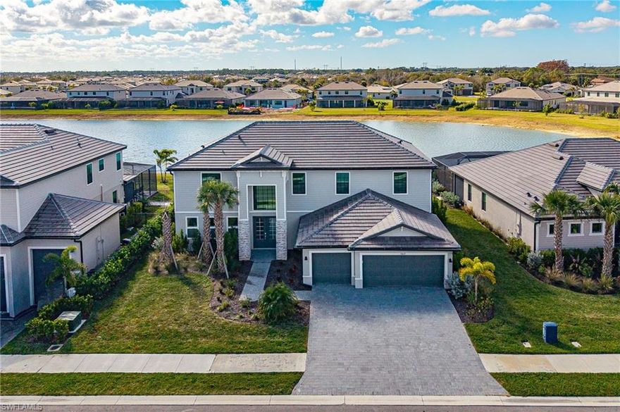 Extraordinary estate home nestled in one of Fort Myers newest gated resort style communities. This stunning new construction home offers almost 4100 square feet of thoughtfully designed living space that your family will absolutely love. Enter through the elegant French doors into an open floorpan with soaring ceilings! The effortless flow through the main level makes entertaining easy. The chef inspired kitchen features gorgeous quartz countertops, a cooktop surface, double oven, and plenty of storage. This never lived in home features impact resistant windows, tile flooring throughout the main floor, dual primary suites, oversized lanai, 3 car garage and so much more.  The generous lot size provides waterfront views and ample room to create your dream pool oasis. Upstairs features a large loft perfect for a large family room, additional bedrooms and a 2nd primary bedroom with large ensuite bathroom. Timber Creek community offers resort style amenities including a clubhouse, fitness center, sauna, pool and spa, pickleball, tennis, volleyball, basketball, bocce, a putting green, and a scenic park. Perfect location in Fort Myers, just minutes from I-75, RSW Airport, top rated schools, shopping, dining, and entertainment. Schedule your showing today!