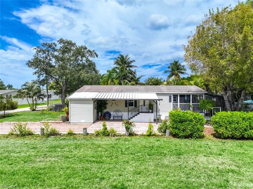 One or more photo(s) has been virtually staged, AI generated or rendered.  Discover a rare WATERFRONT opportunity in the highly sought-after Rookery Bay area! Located on a quiet, private street with only four homes, this GULF-ACCESS property offers the ultimate Southwest Florida lifestyle with NO HOA FEES.. This immaculate 2-bedroom, 2-bath manufactured home features soaring 10-foot ceilings, elegant crown molding, and a bright open floor plan designed for comfortable living and entertaining. The spacious kitchen flows seamlessly into the main living areas, creating an inviting atmosphere throughout. Step outside to your oversized screened-in porch—perfect for relaxing or hosting—overlooking beautifully landscaped grounds that lead directly to the water. Boating enthusiasts will appreciate the PRIVATE DOCK and BOAT RAMP, providing direct GULF ACCESS via Henderson Creek. Enjoy world-class fishing right from your backyard and quick boating access—just minutes to Rookery Bay and approximately 20 minutes to Keewaydin Island. A true hidden gem for boaters, fishermen, and those seeking a peaceful waterfront retreat—this is Florida living at its finest!