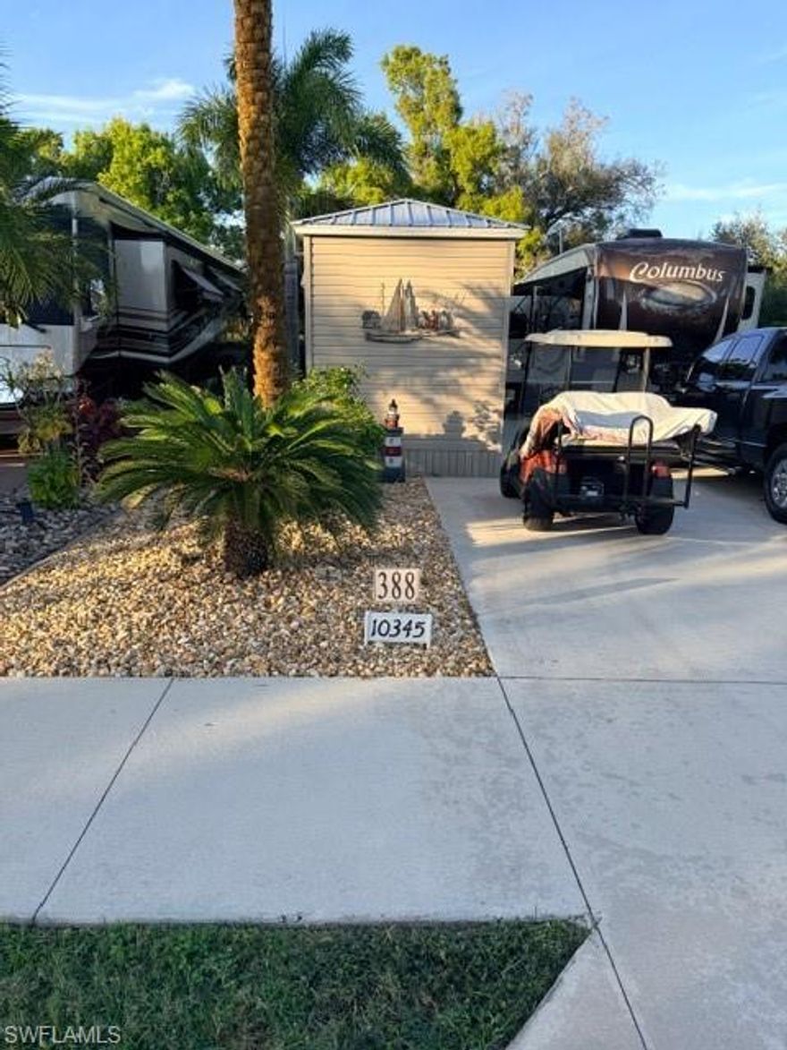 Lot 388 is a concrete south facing back in lot that can accommodate any type of RV.  It sits on a quiet street called prairie Iris trl, In Cypress Trail RV Resort.  The side yard and the back patio area is paved with neutral colored pavers. Some of the plantings on this lot are Sylvester Palms, Sago palm, Holly, Manila palm and some cocoa plums for privacy.  There is a 12 x 14‘ metal  gazebo complete with some crank down shades for more privacy, a ceiling fan and patio lights surround the ceiling area. This has survived two hurricanes so is very stable.  Also on the Lot is an Amazon 8 x 15‘ shed with a toilet and a sink. The rest of the shed is unfinished so you can custom finish it to your needs. Any storage of personal property property is very easy because you have twin double doors on the shed.  The rear patio area offers even more relaxing space in a super large open green space to the north where there are no neighbors close by and the green space gives you an opportunity to walk your dog directly from this lot  to the dog park.  The lot is very convenient to the clubhouse for activities and is also right down the road to the garbage and recycling area. Don’t miss this very pleasant lot competitively priced.  Call Jim at 920-948-2500 for additional information.