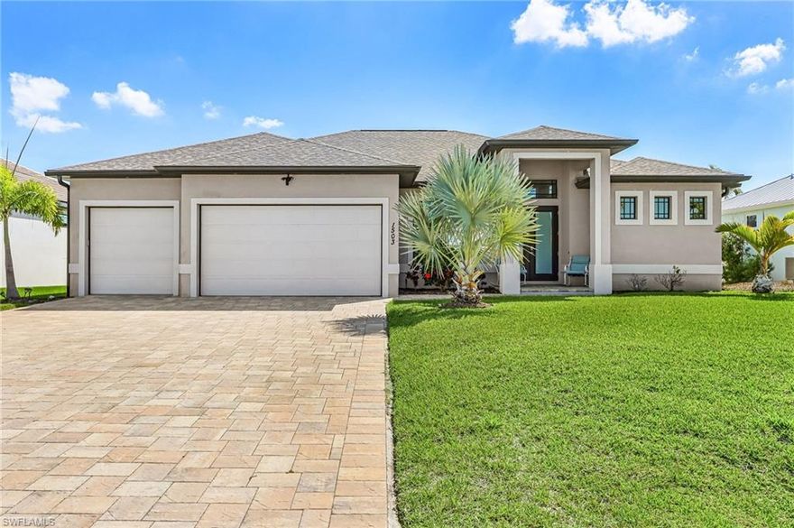This BEAUTIFUL custom built 2019 Gulf Access POOL home located in the popular Northwest Cape Coral is a MUST SEE!!  Launch your Florida Lifestyle with this SPACIOUS TURNKEY home which has 2,279 sq ft, 3 bedrooms, plus den, 3 baths, formal dining and 3 car garage.  Home has tons of natural light, features OPEN split floor plan, frosted French entry doors, tray ceilings, 8' interior doors, with granite countertops and tile floors throughout the home. The HEART of the home is the elegant kitchen which is perfect for entertaining large crowds with ample granite countertop space, an island breakfast bar with seating for 6, tons of storage space in the white shaker soft close cabinets, 42" wall cabinets, upgraded lighting fixtures, stainless-steel appliances, and a walk-in pantry. The living / dining area has 90-degree glass sliders so you can enjoy the view of the pool and beautiful LARGE outdoor living space. The sliding doors have tinted glass and interior electric remote controlled custom shades.  Enjoy the large primary suite which has access to the lanai and two walk-in closets with built-ins.  The GORGEOUS bathroom has spacious double vanities with beautiful granite countertops, walk-through shower, soaking tub, private toilet, and linen closet for extra storage. The IMPRESSIVE Lanai was built for RELAXATION and ENTERTAINING with heated saltwater pool and jacuzzi, pavers, outdoor kitchen with dining space, pool bath, outdoor shower, and several seating and sunning areas so you can enjoy the abundant Florida SUNSHINE! One of the guest rooms has a pool bath, both guest rooms have plantation shutters.  There is a storage closet just before the entry into the laundry room which has a laundry sink, beverage refrigerator and comes with washer and dryer. The home has a large 3 car garage with epoxy floor, man door exits to side yard to access whole house Reverse Osmosis system, raised concrete pad for outdoor AC unit, pool equipment and pool heater. This home is in a quiet and friendly neighborhood on a dead-end street.  The home is conveniently located less than 4 miles from Burnt Store Boat Ramp, within 5 miles to grocery stores, restaurants, banks, gas stations, and shopping. In just over 5 miles you will arrive at the POPULAR destination of Matlacha which features many waterfront dining restaurants and many local artisan shops.  You will also be close to some EXCITING new projects planned like Tropicana Park, Cape Coral Grove Town Center, and the future 50-acre Seven Islands project.  There are MANY reasons why so many people LOVE & call Northwest Cape Coral their HOME!  Call TODAY for private showing! CLICK links for 2 tours: 3D interactive tour ALSO see Walk-Through tour.